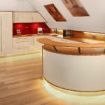 Modern kitchen with curves and layered lighting