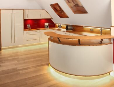 Modern kitchen with curves and layered lighting