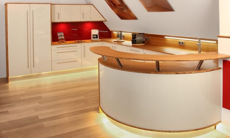 Modern kitchen with curves and layered lighting